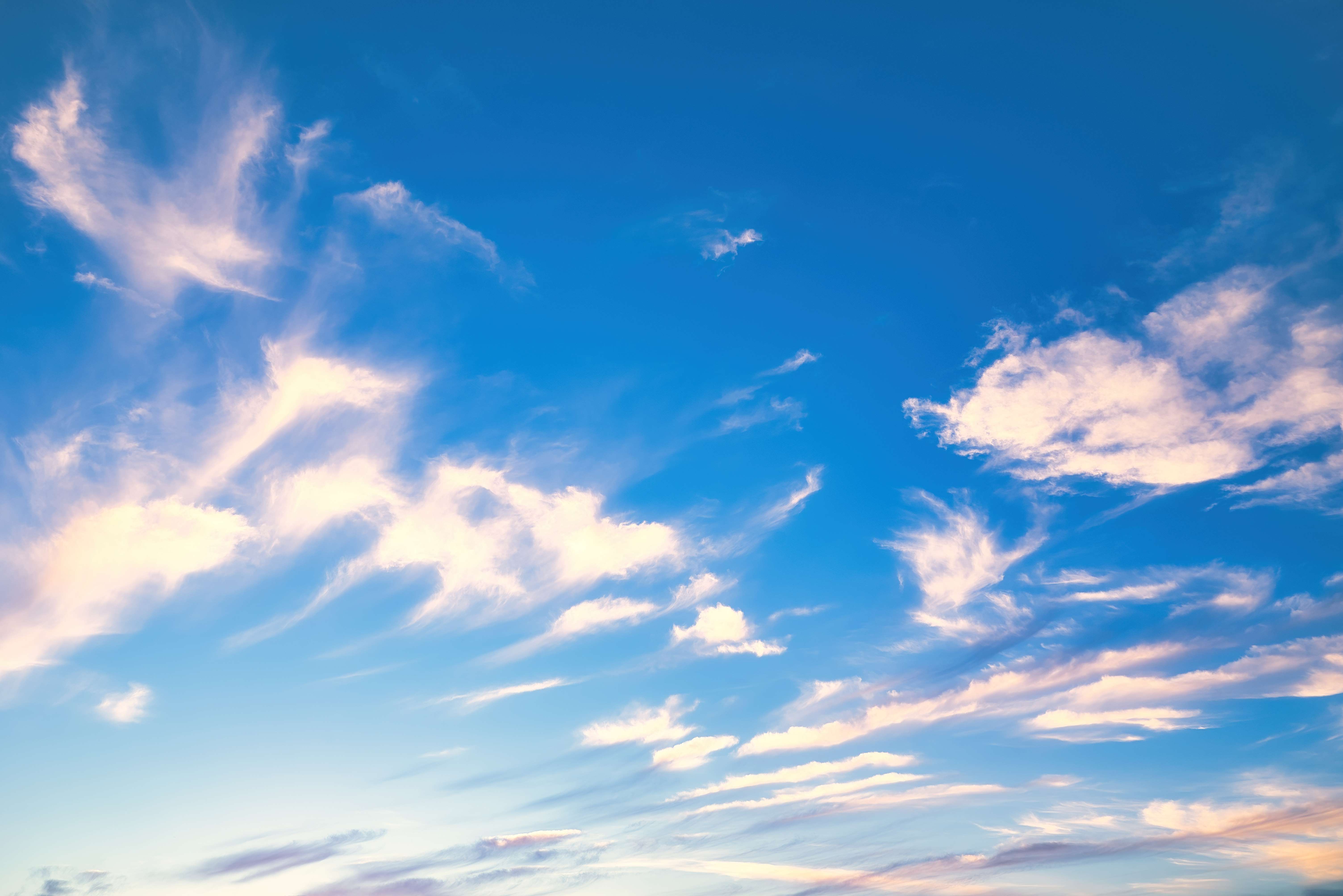 wispy clouds on blue sky